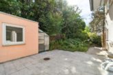 Energetisch saniertes Einfamilienhaus mit Garten und Garage in bevorzugter Lage - Terrasse hinter dem Haus
